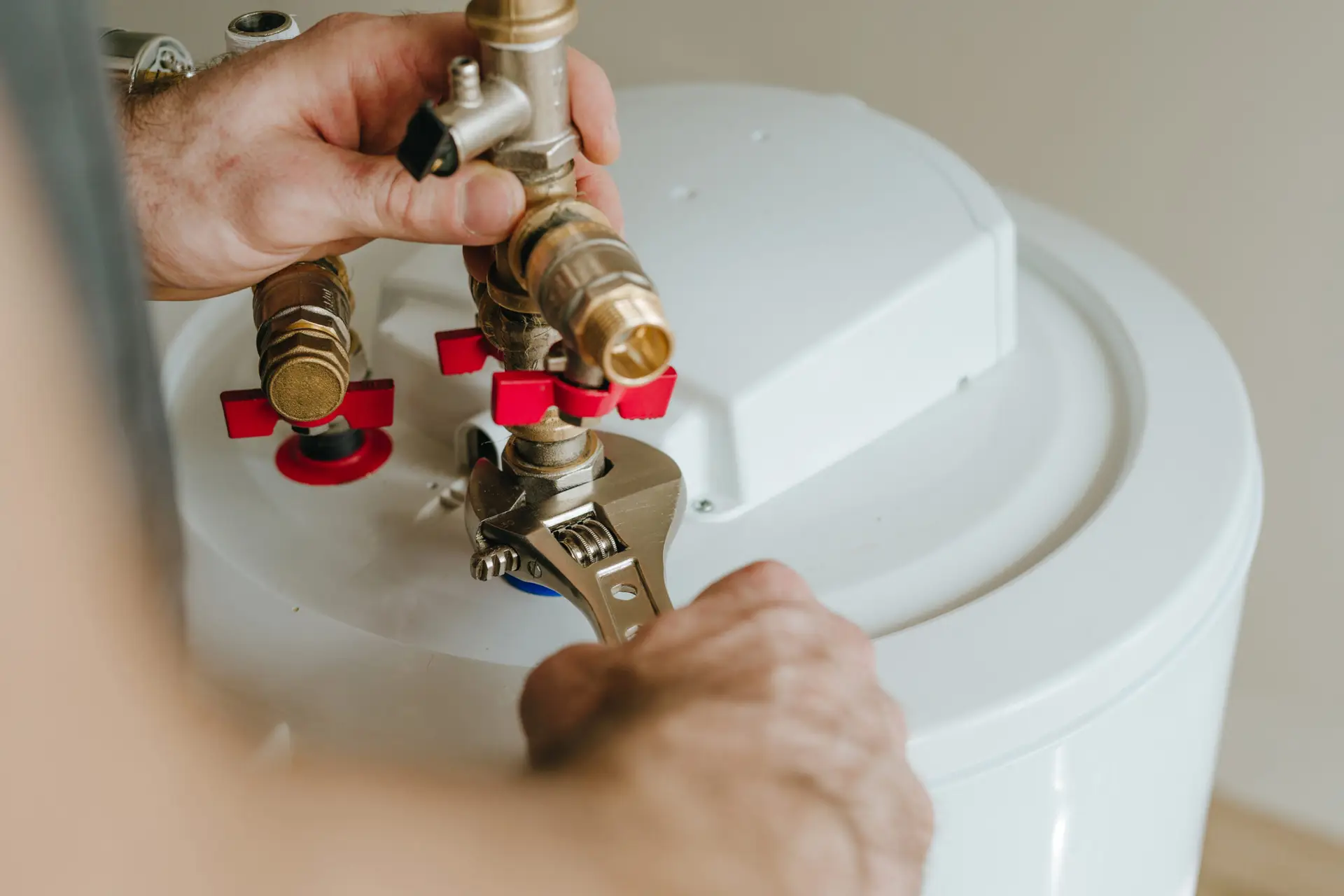 HVAC technician working on the installation of a water heater