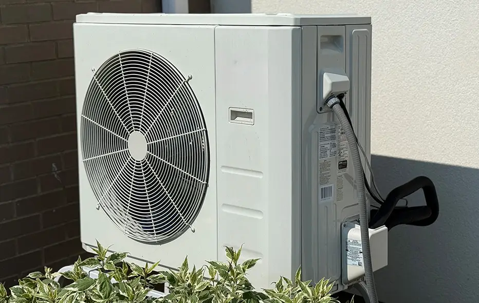 Heat pump shown outside a house