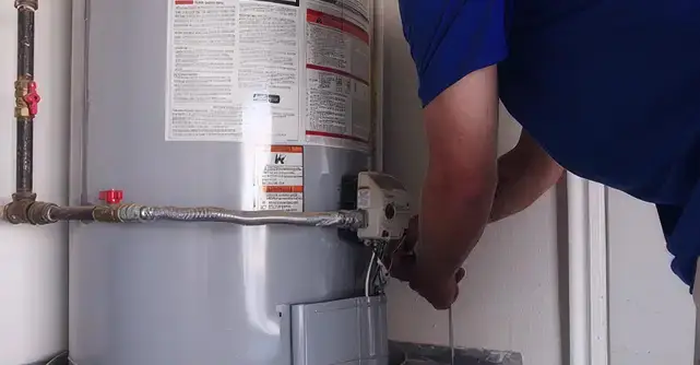 Burton employee working on a water heater